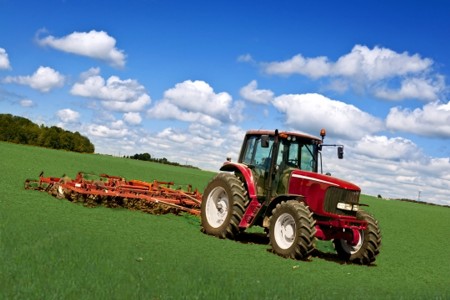 Tractor in green fields